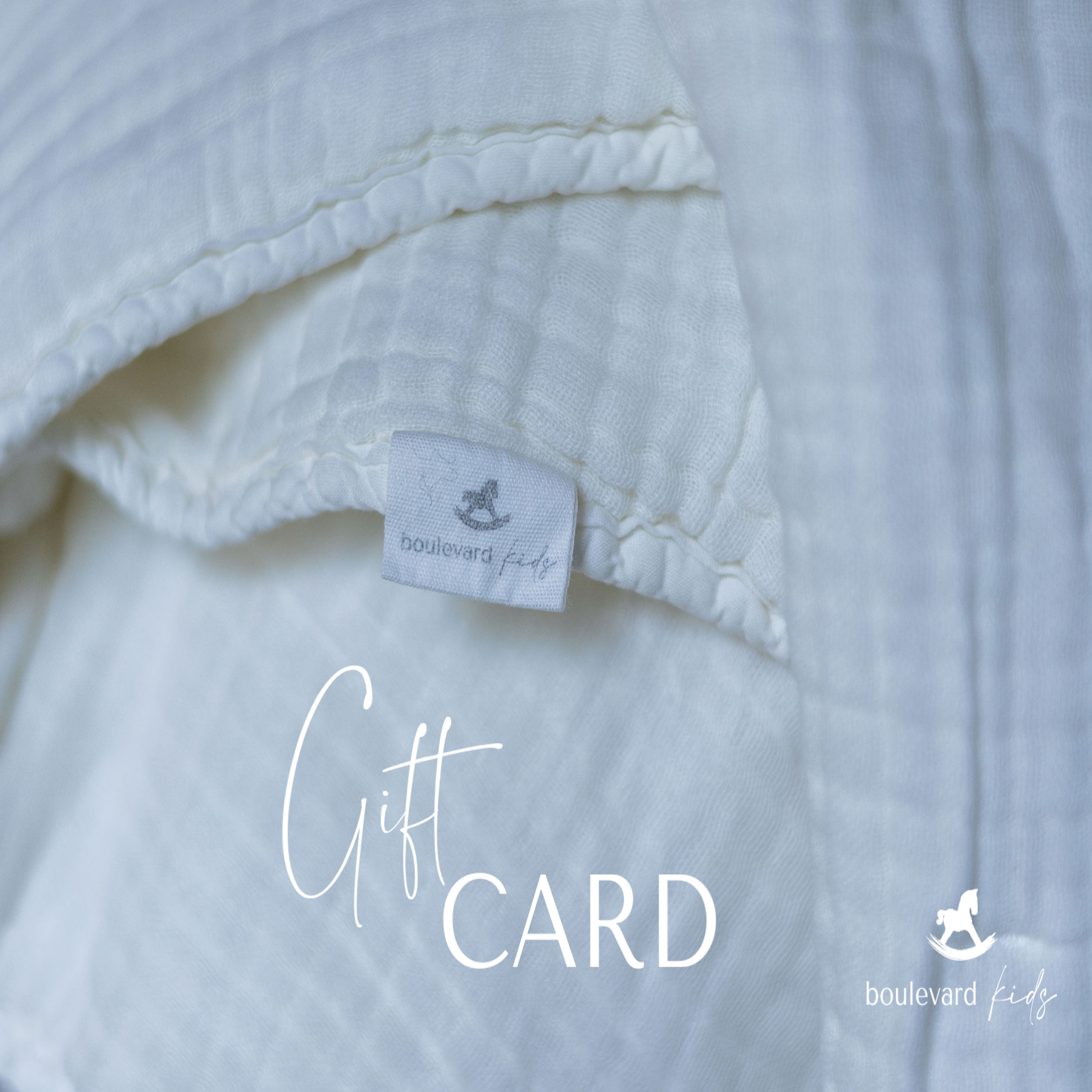 Close-up of a white textured fabric with a visible label and 'Gift Card' text overlay.